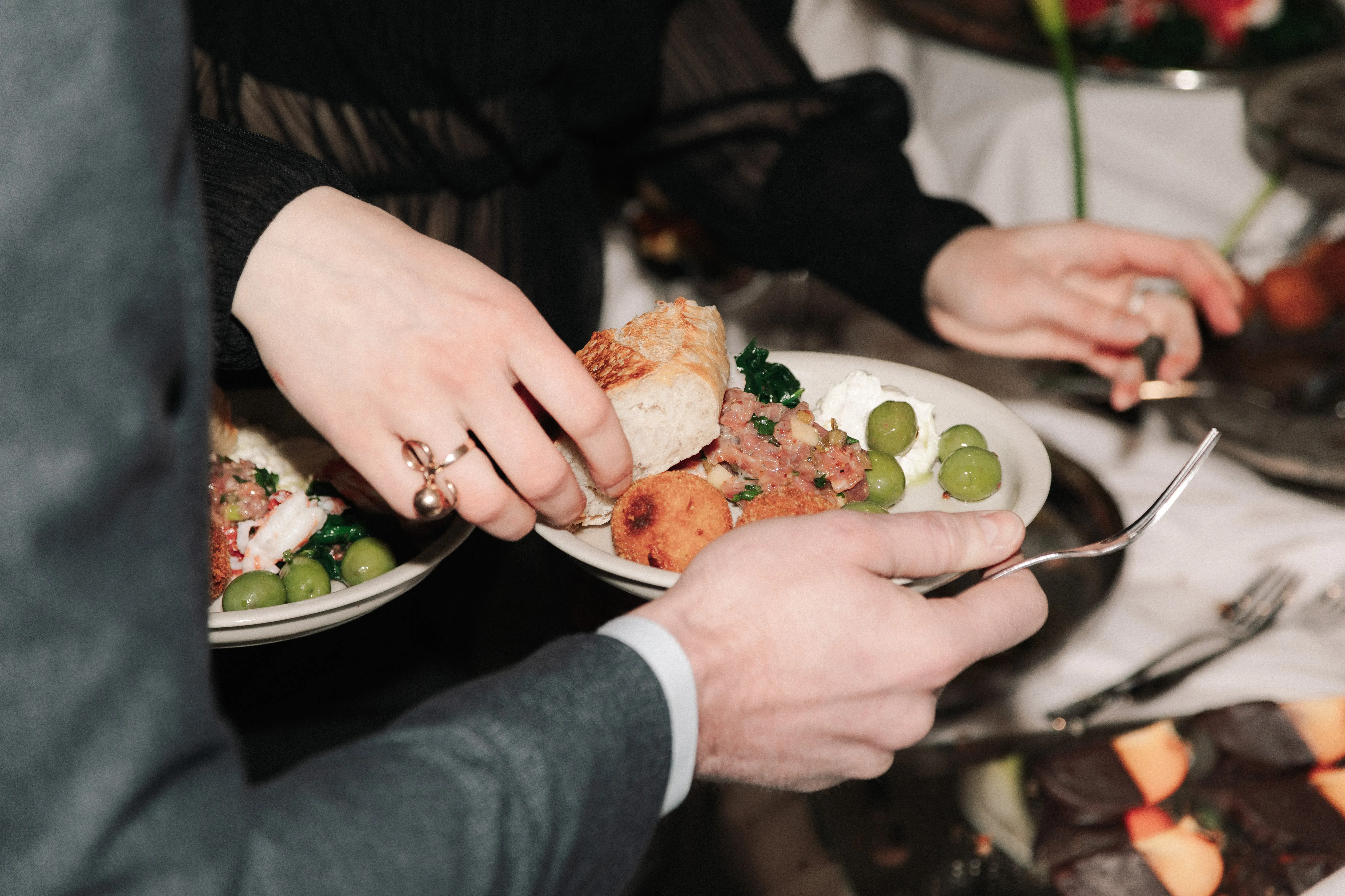 Guests plating food at a mana catering event