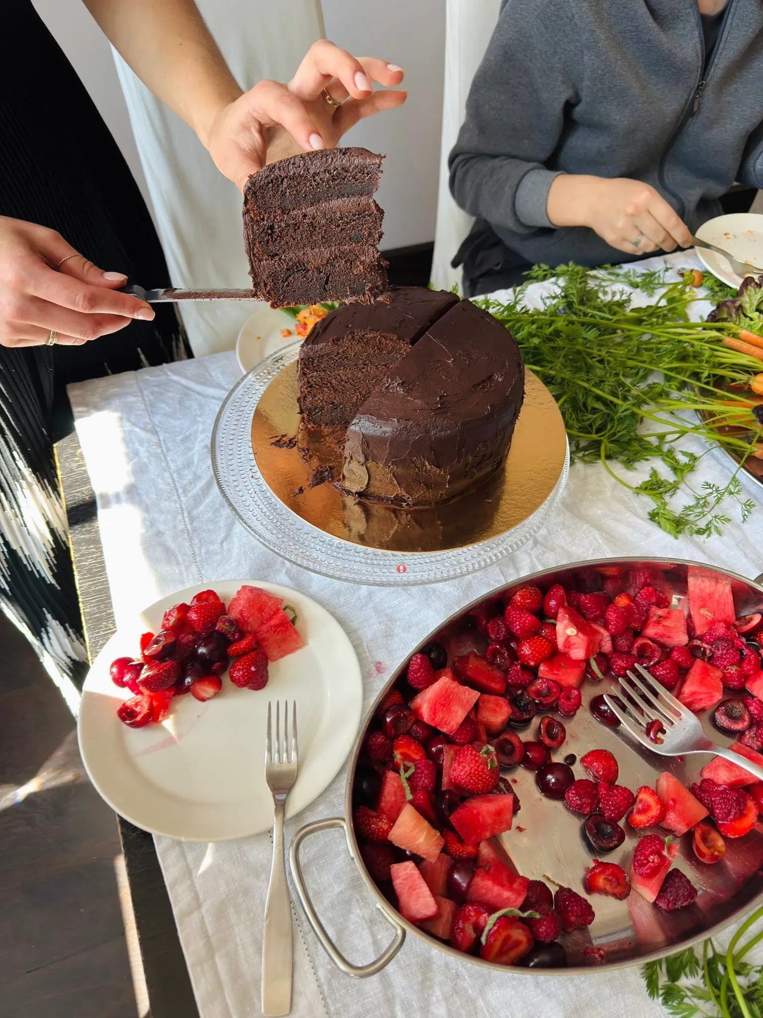 Chocolate cake with fresh fruit at a supper club evening